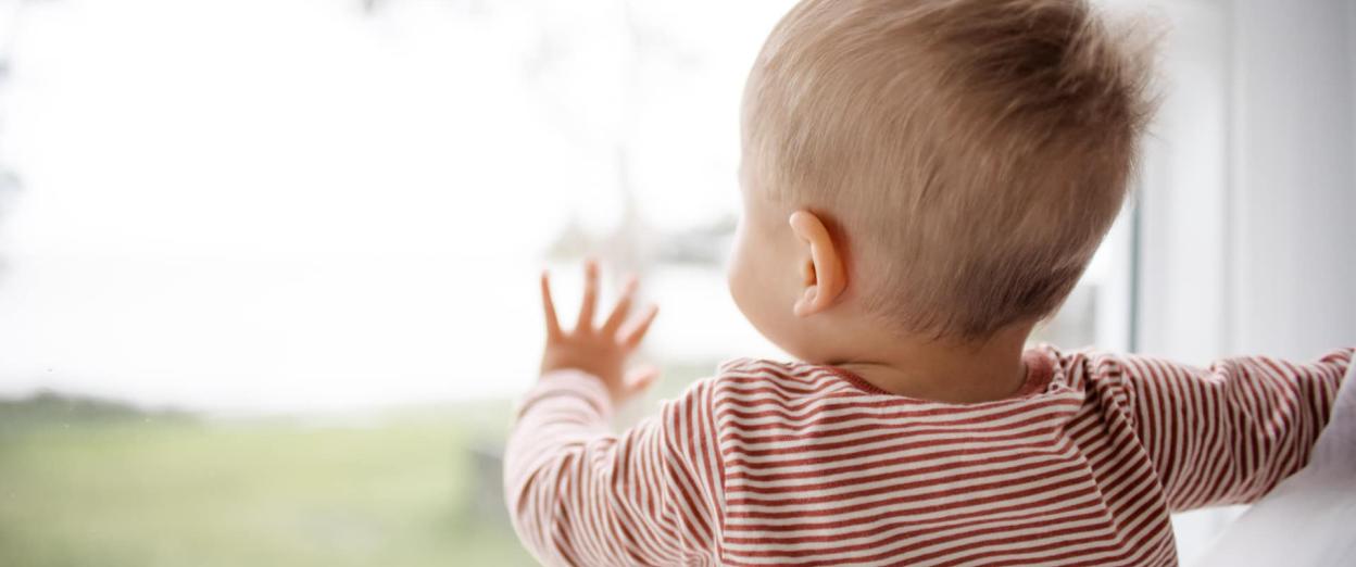 baby looking out window awake