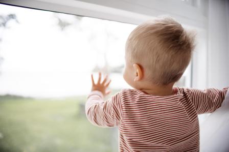 baby looking out window awake