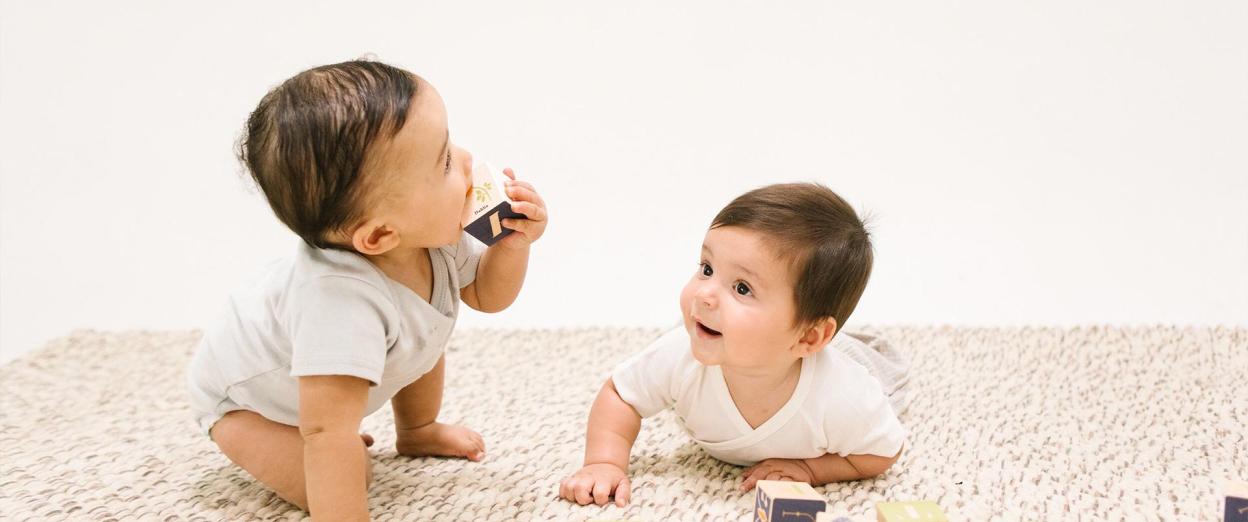 babies playing with blocks at daycare