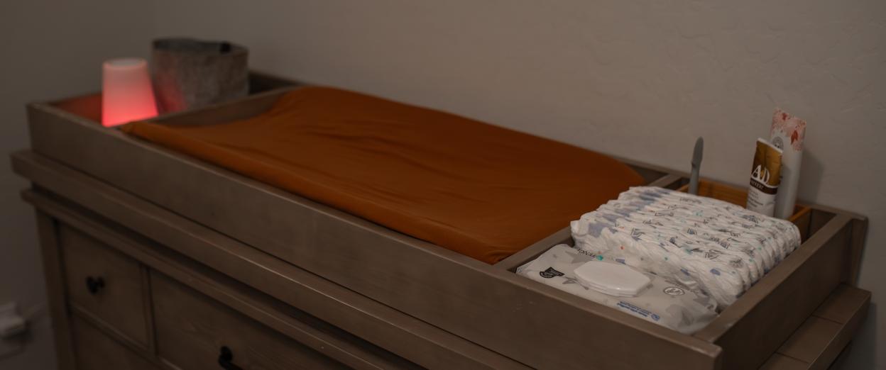changing table with low light and red night light for changing diapers at night
