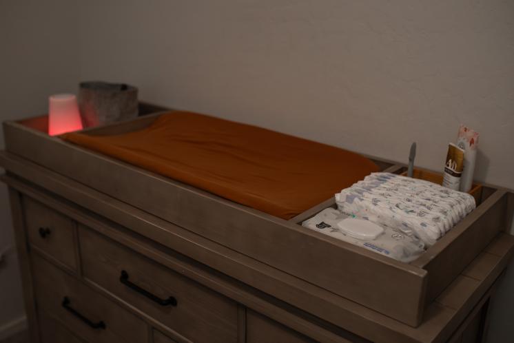 changing table with low light and red night light for changing diapers at night