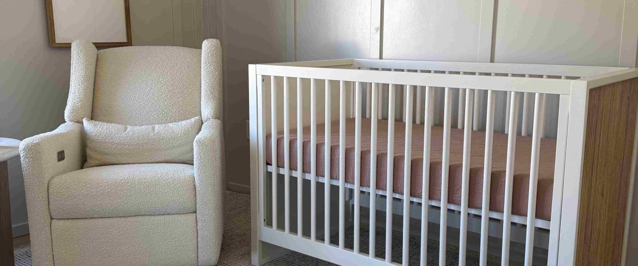 baby nursery with crib and rocking chair
