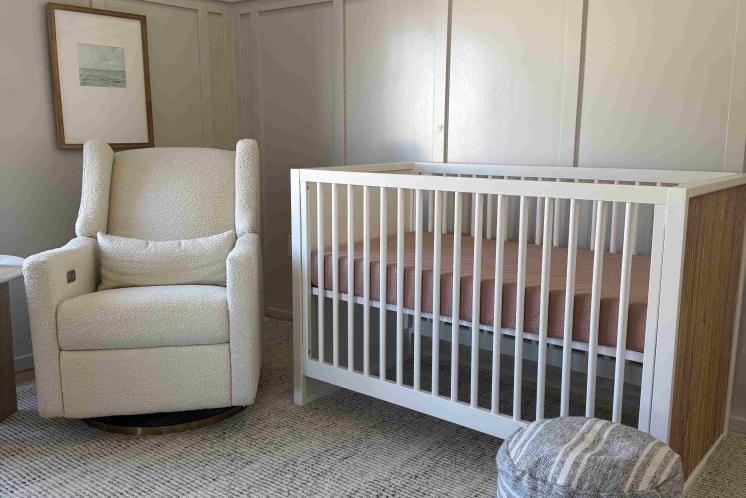baby nursery with crib and rocking chair