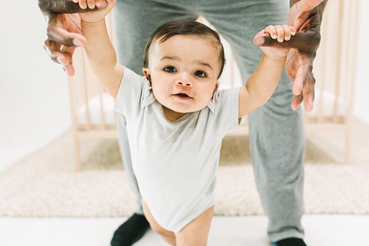 baby walking with Dad during awake time between naps