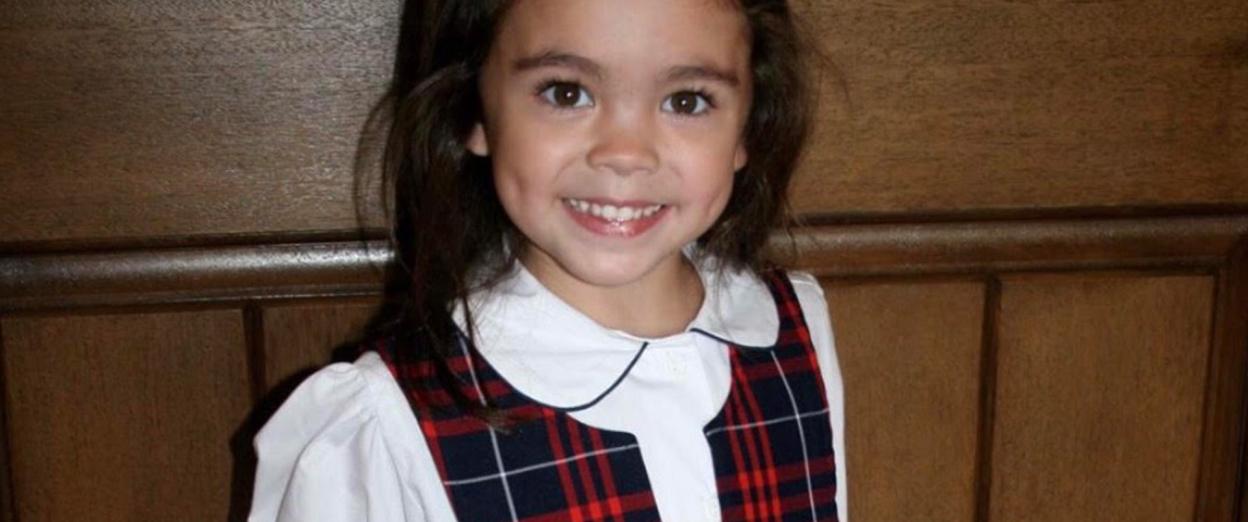 little girl in Kindergarten school uniform