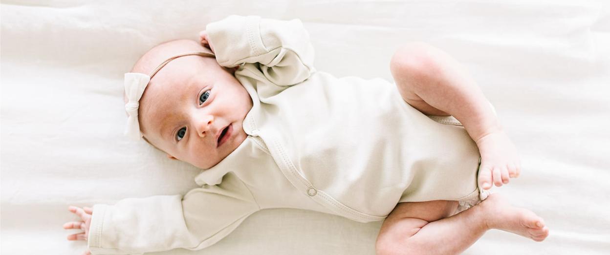 happy one month old baby during awake time