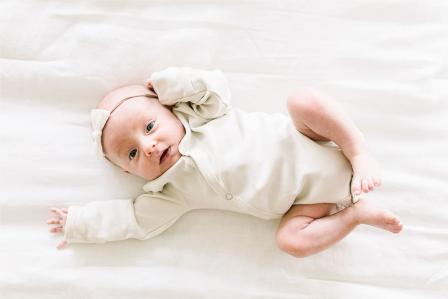 happy one month old baby during awake time