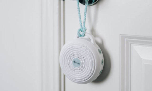 rohm portable sound machine hung on door knob