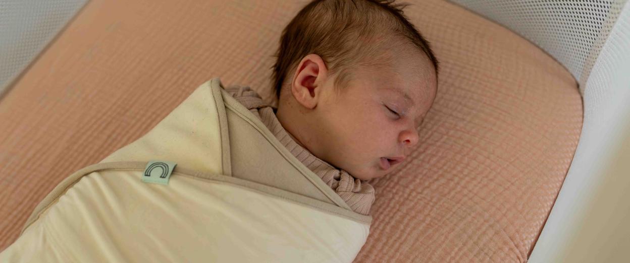 swaddled baby sleeping