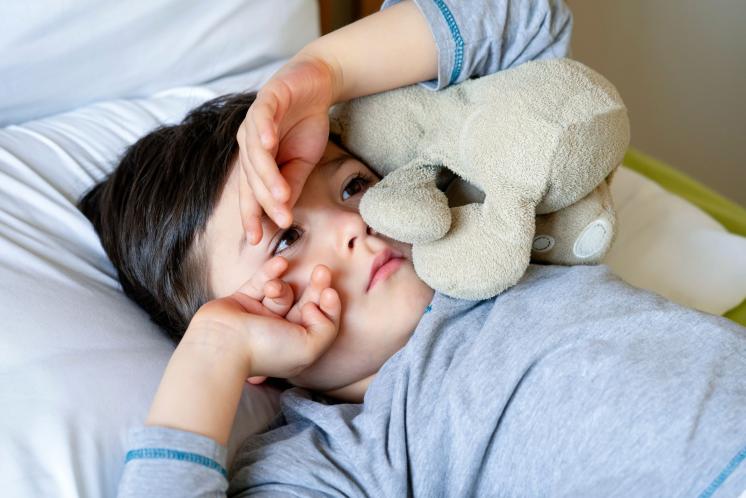 Toddler laying awake in bed after waking up too early
