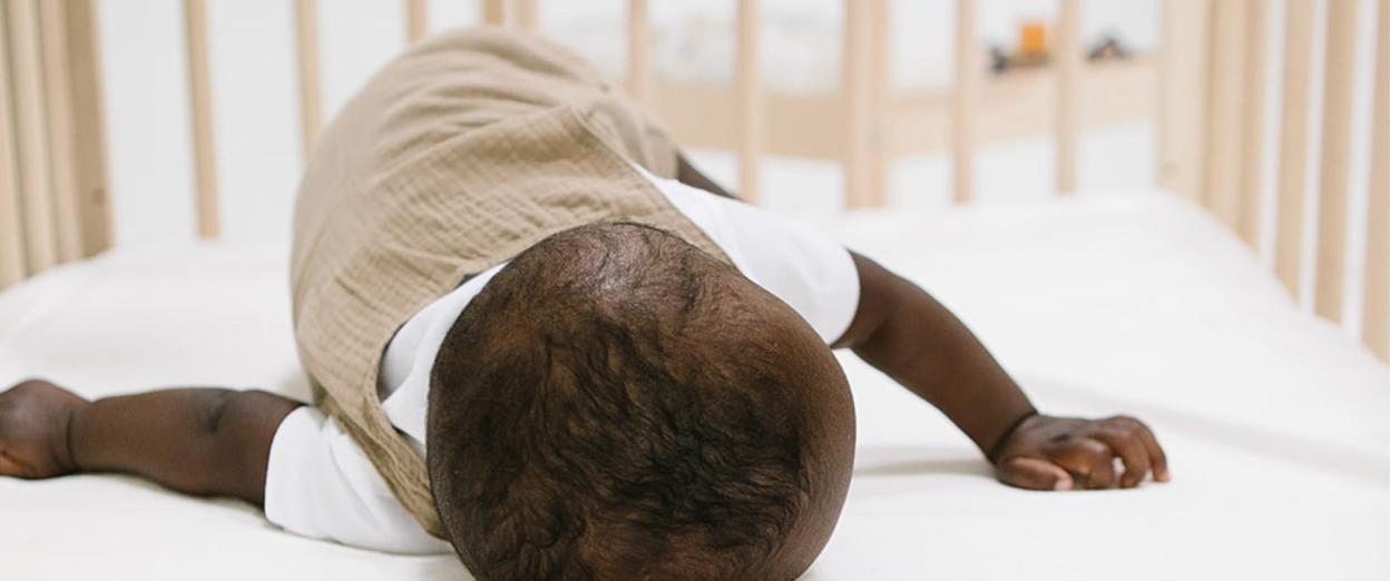 Baby safely sleeping on tummy