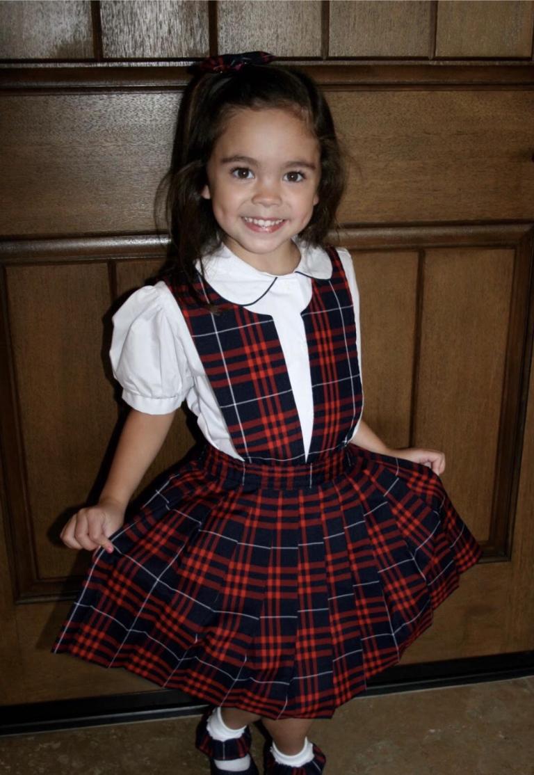 Kindergartner girl in school uniform
