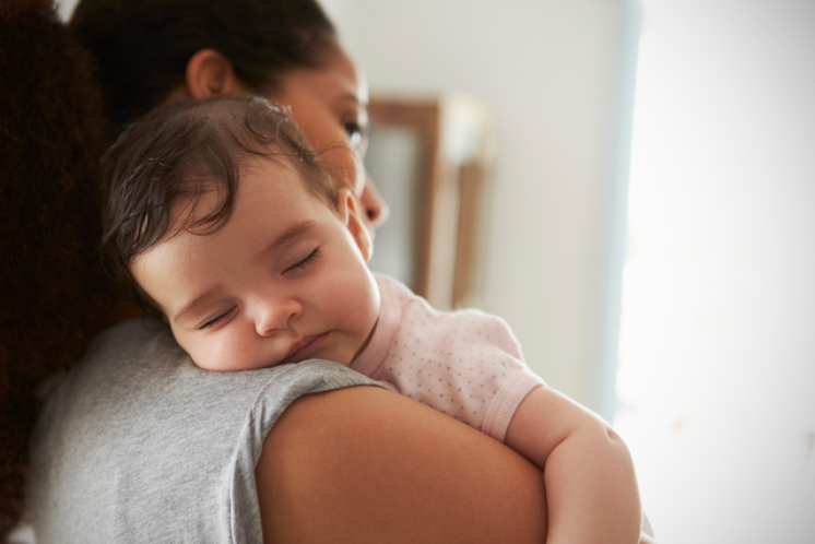 baby girl fell asleep on mom's shoulder during asleep regression